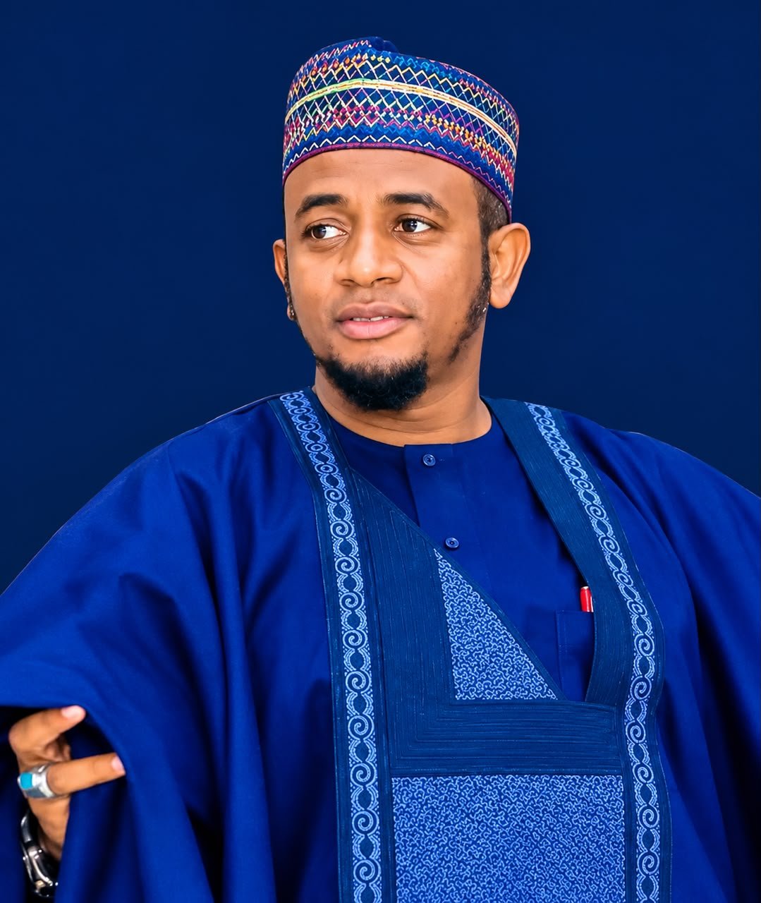 Portrait of Distinguished Sen. Shehu Buba in a royal-blue agbada and embroidered cap